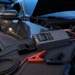 KingTool jump starter with air compressor beside a parked car