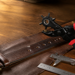 KingTool rotary leather hole punch with a brown leather belt